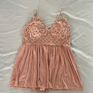 Peach coloured tank top with built in bra